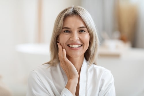Closeup,Photo,Of,Attractive,Blonde,Middle,Aged,Woman,In,White