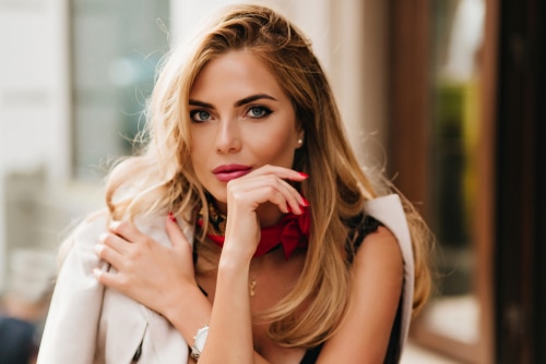 Optimistic,Blonde,Woman,With,Beautiful,Blue,Eyes,Posing,During,Rest