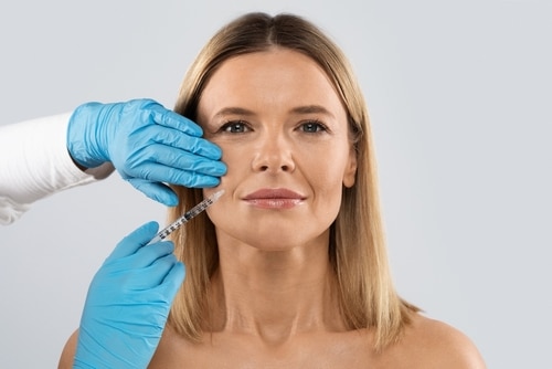 Nasolabial,Fold,Filler,Procedure.,Beautiful,Half-naked,Blonde,Middle,Aged,Woman